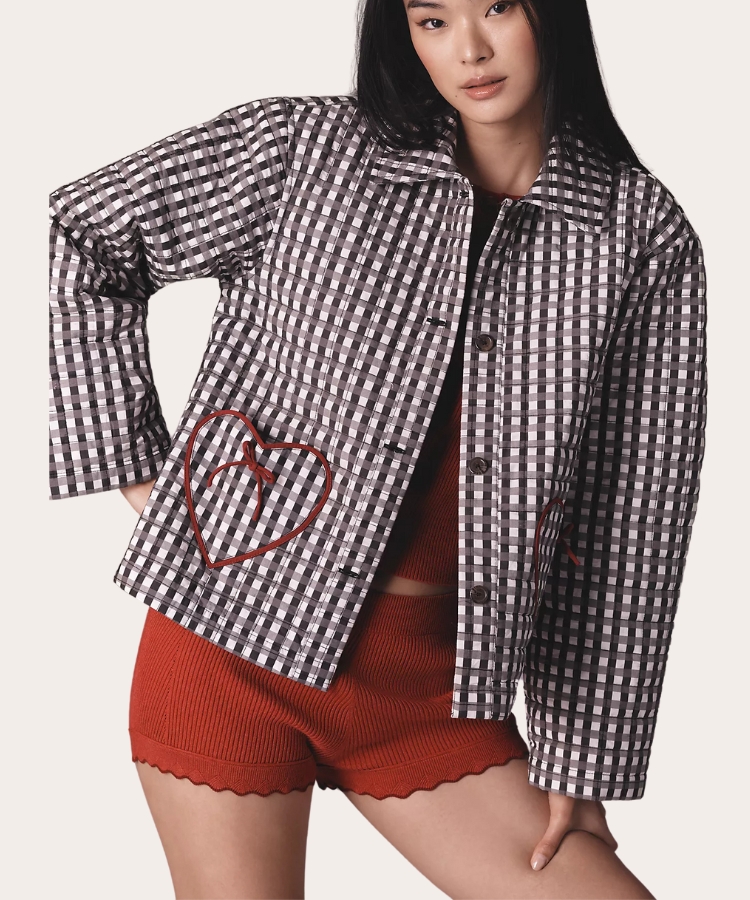 A quilted jacket with heart patterns and textured stitching.