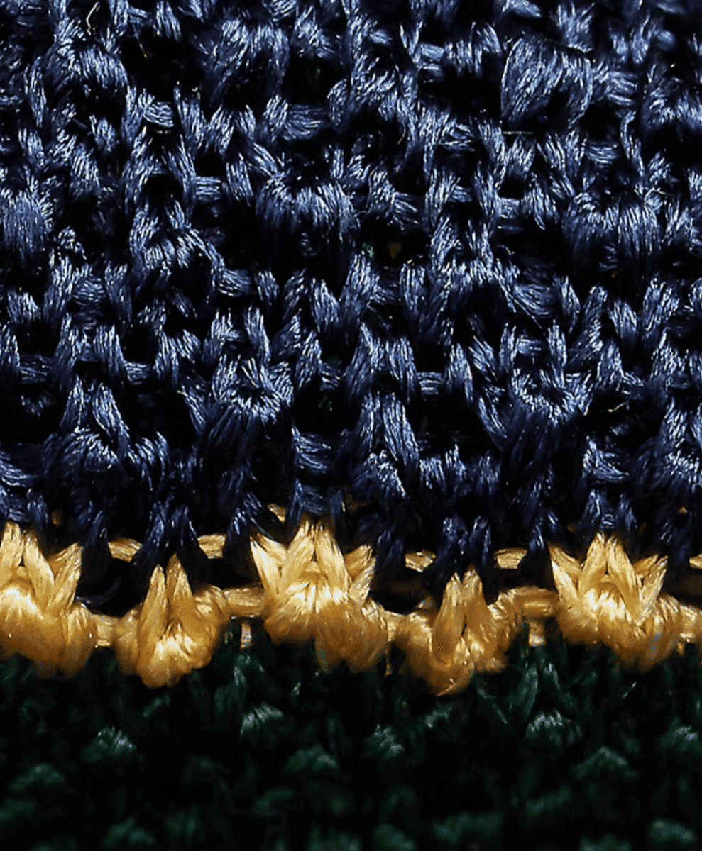 Detailed weave of a red Polo Ralph Lauren knit tie