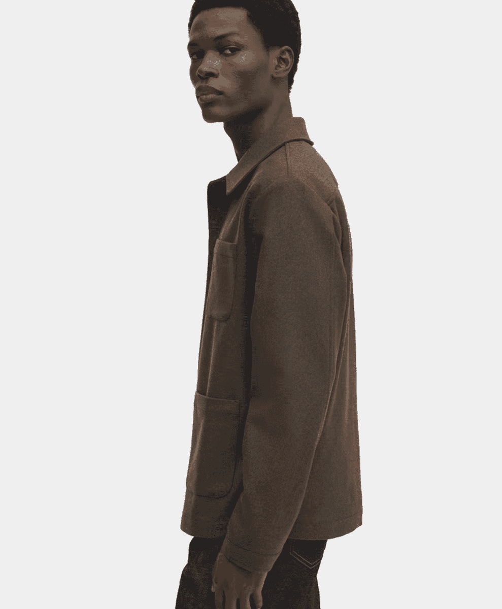 Profile shot of a man in a brown textured wool jacket.