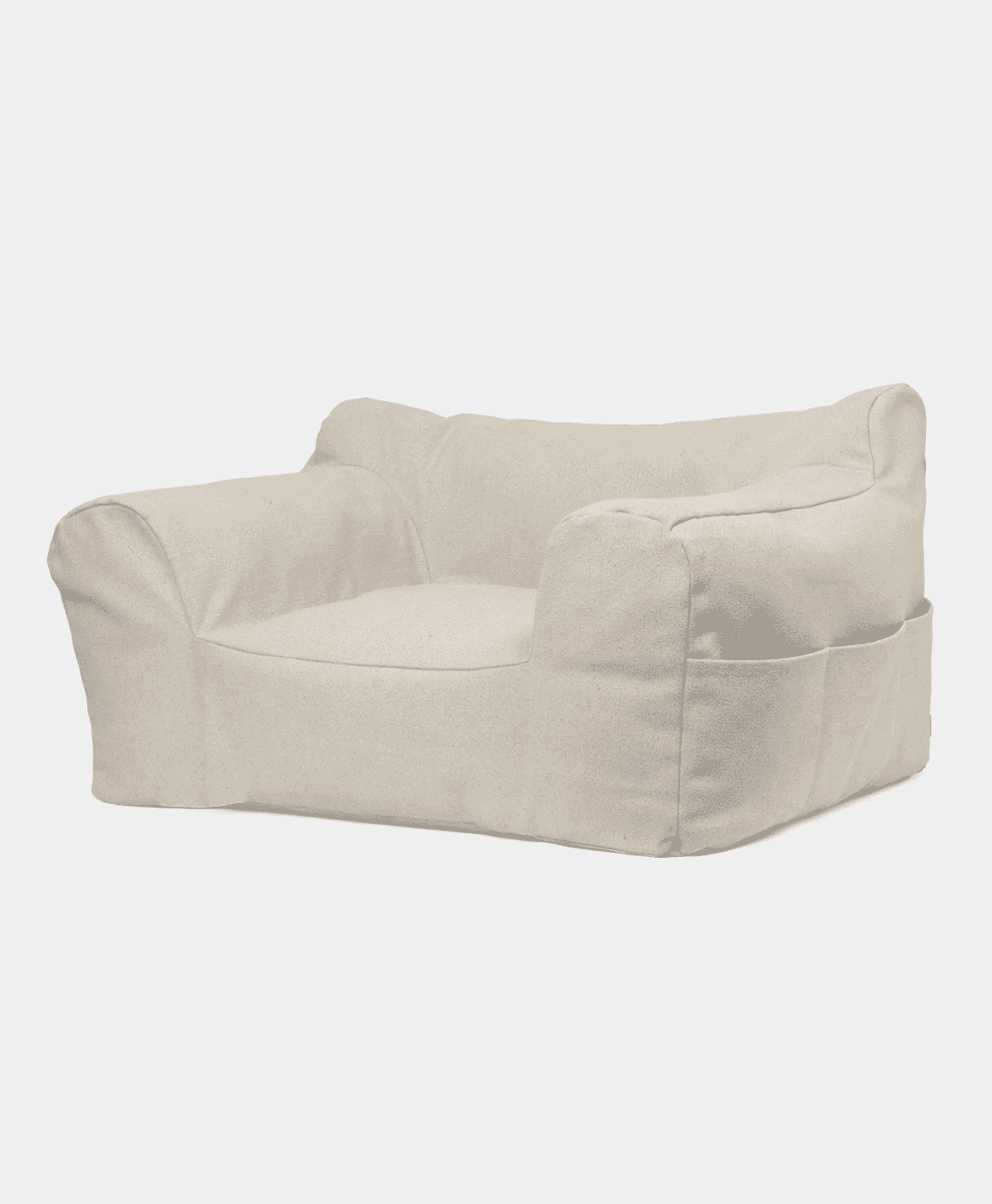 Ferm Living Billow bean bag chair in off-white with integrated side pockets for functionality.
