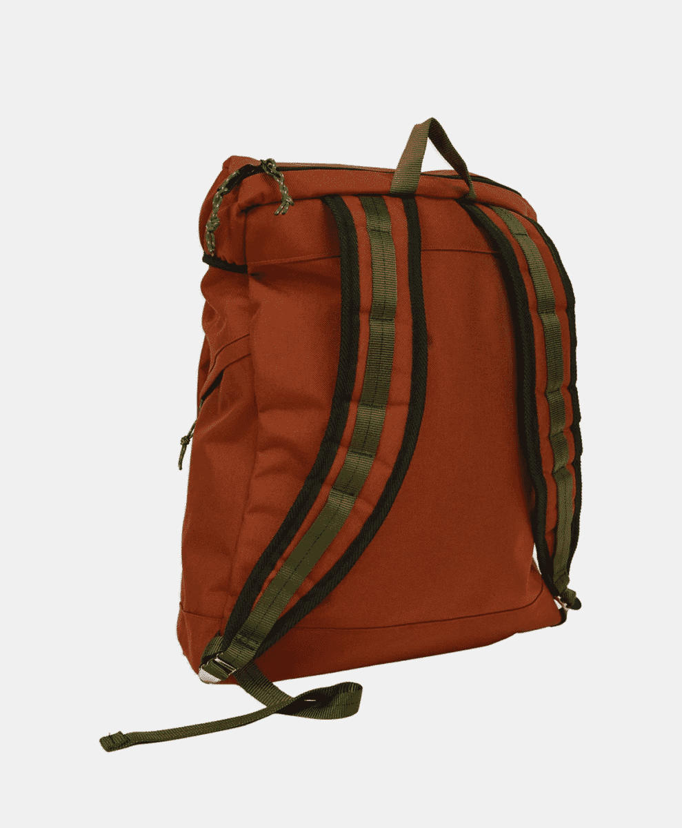 Back view of the rust-orange backpack showing olive green webbing and straps.