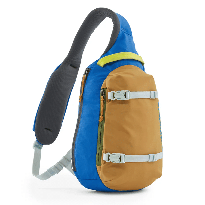 A blue and tan Patagonia sling backpack featuring an 8L capacity and adjustable straps.