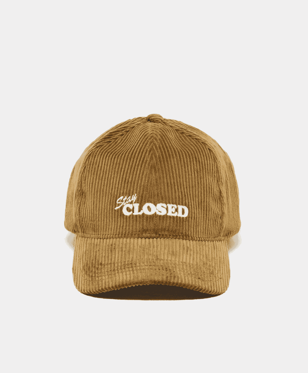 Tan corduroy cap with 'Stay CLOSED' embroidery.