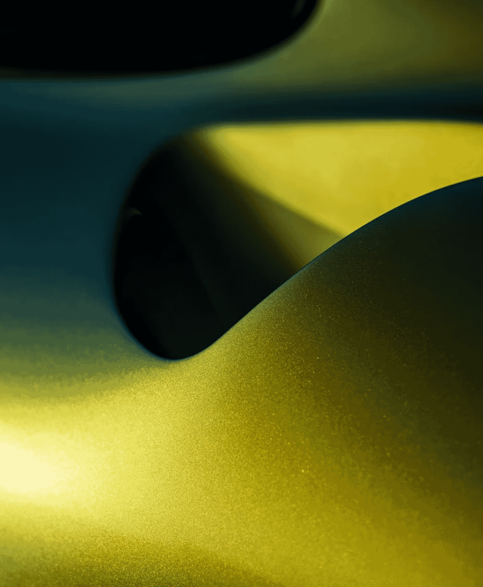 Close-up of textured fabric with golden-yellow and deep green hues.