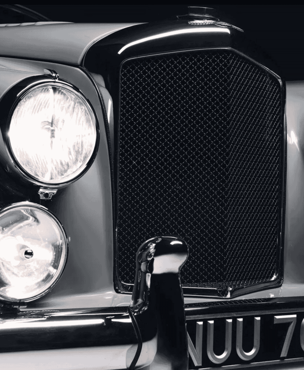 Close-up of a 1953 Bentley front grille with chrome accents.