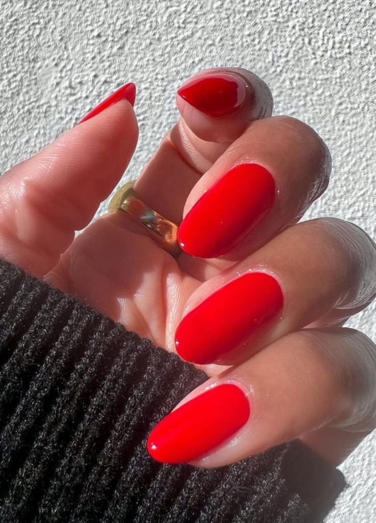 Classic bright red manicure with a high-gloss top coat.