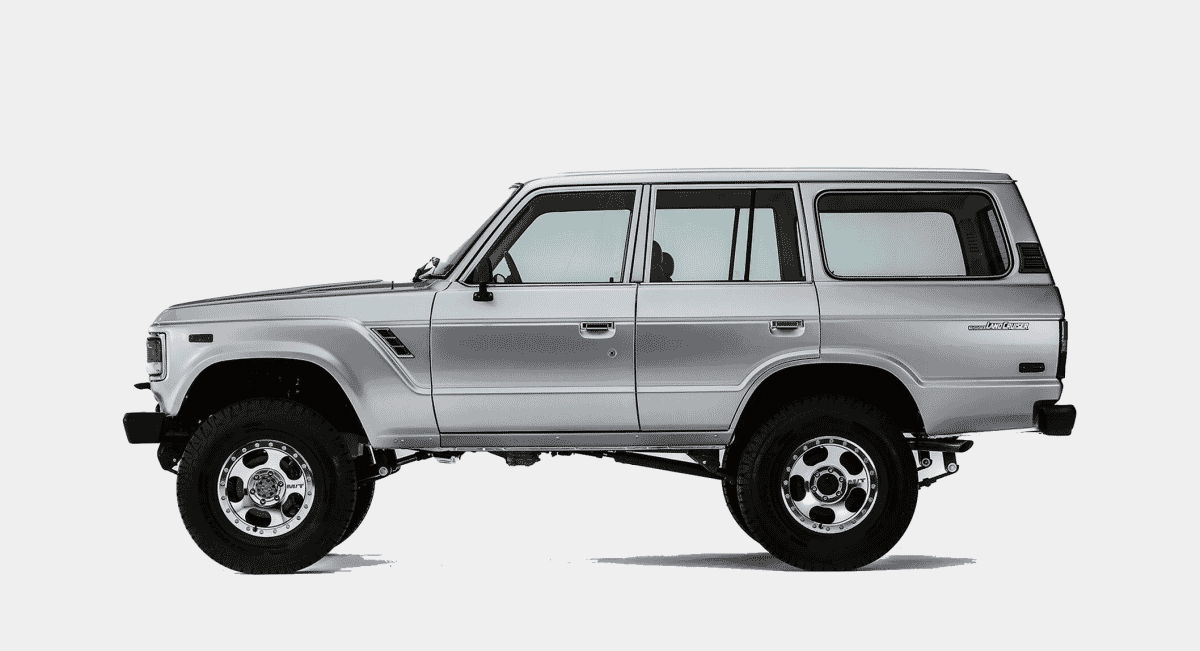 Side profile of a silver Toyota Land Cruiser highlighting its utility and off-road silhouette.