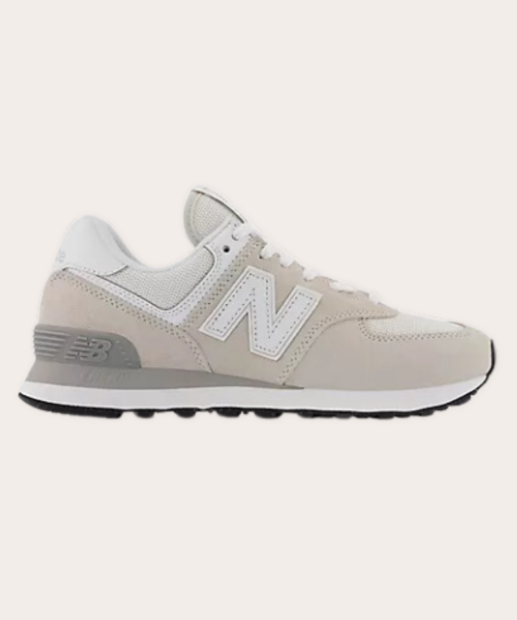 New Balance 574 sneakers in a classic grey and white colorway.