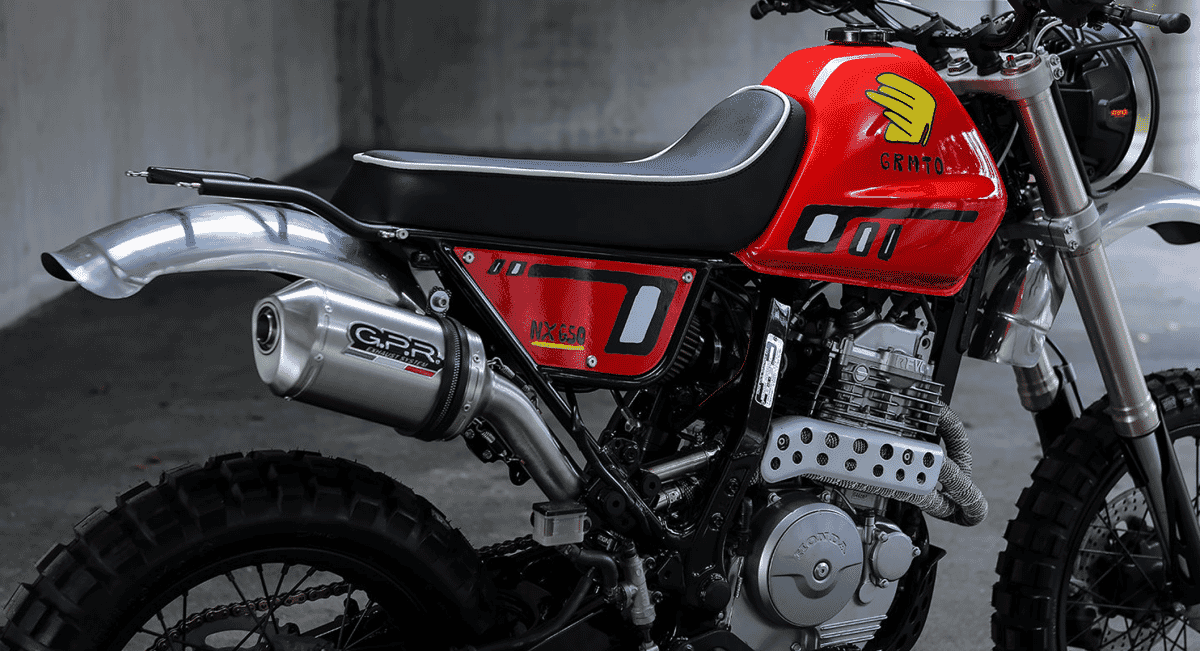 Mid-shot focus on the Honda NX650 engine and the GPR exhaust with GRMTO branding.